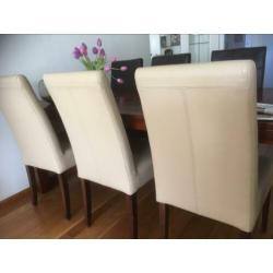 Eetkamerstoelen beige leer drie stuks
