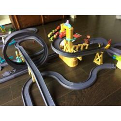 Chuggington baan en heel veel treintjes, met koffer en DVD's