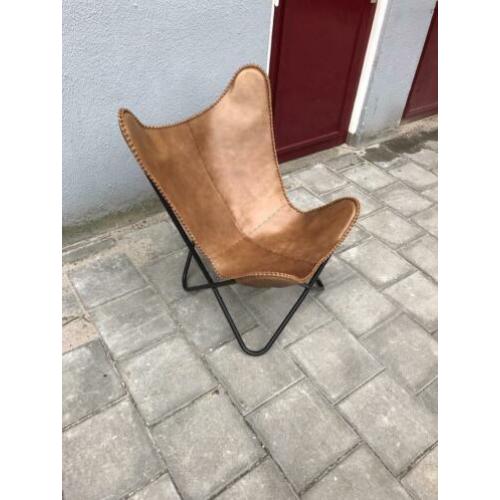 Design vlinderstoel.cognac leer met stevig demontabel frame.