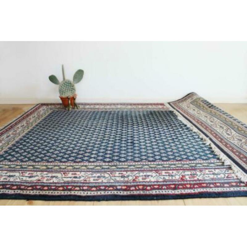 Handgeknoopt blauw Perzisch tapijt. Oosters vintage kleed